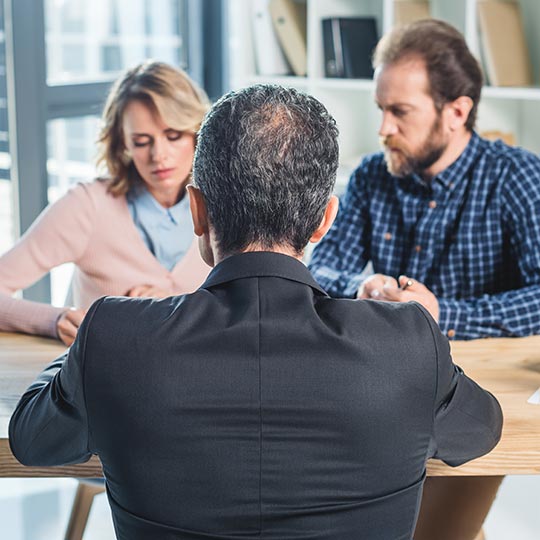 couple having meeting with lawyer